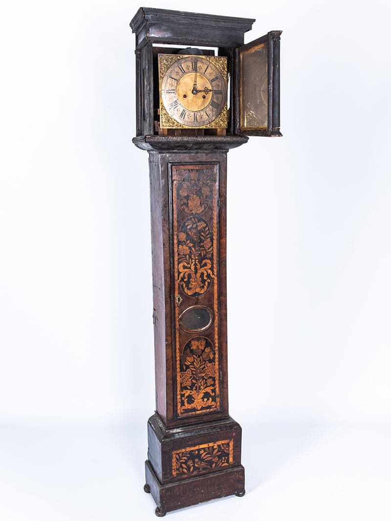 a longcase clock before furniture restoration treatment in the Plowden & Smith furniture restoration studio
