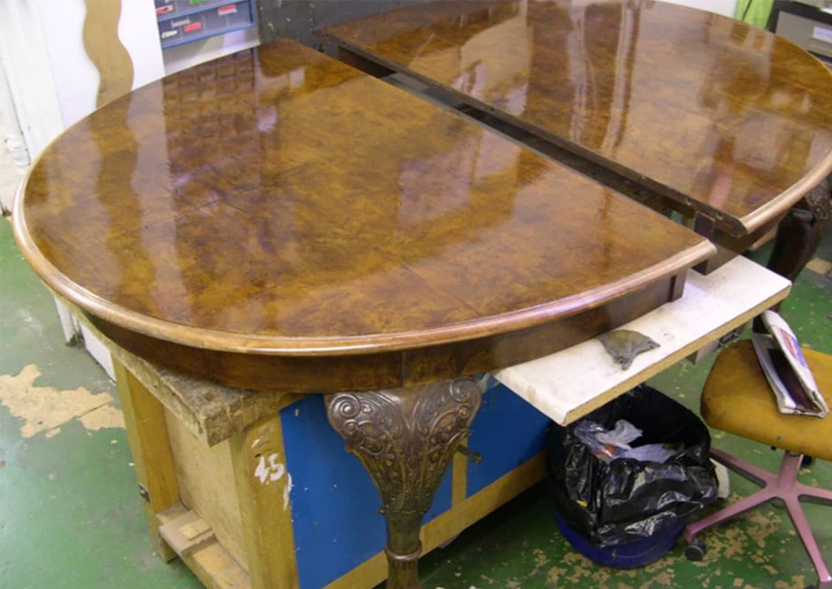 walnut dining table after furniture restoration treatment