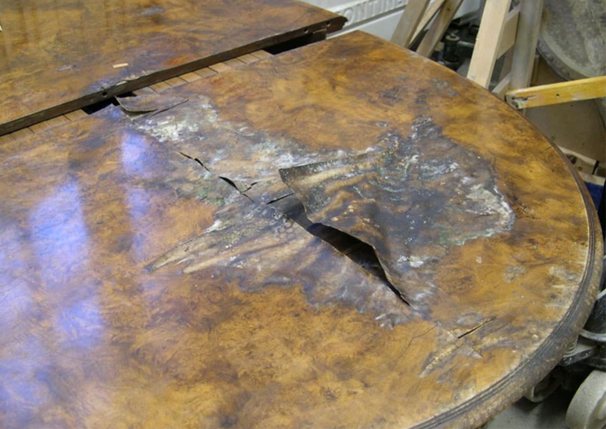 walnut dining table before furniture restoration treatment
